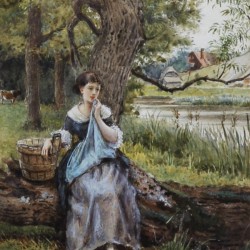 A girl sitting by the lake